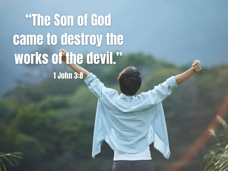A person standing with arms raised toward open hills, over the words “The Son of God came to destroy the works of the devil.” — 1 John 3:8.
